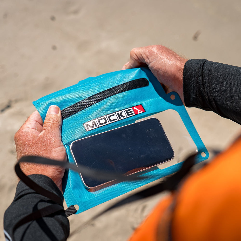 Mocke Cellphone Dry Bag turquoise, overhead view with phone inside