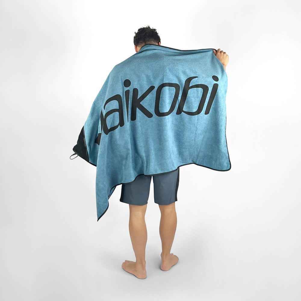 Vaikobi Beach Towel with Zip Pocket Ocean Blue - front view worn over shoulders