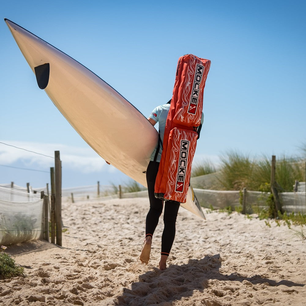 Mocke Deluxe Paddle Bag orange, carrying surfski on beach
