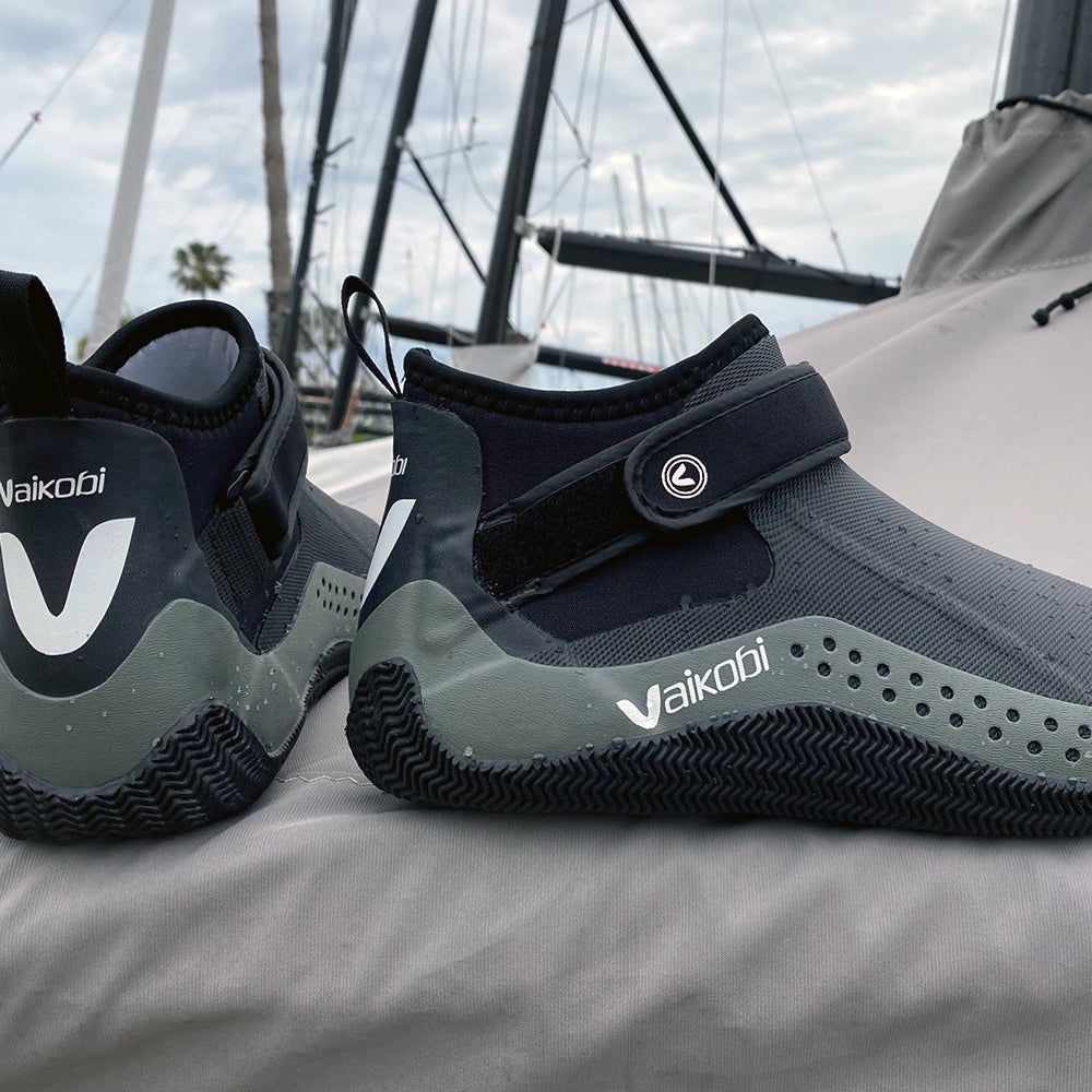 Vaikobi Speed Grip Low Cut Boot in front of sailing boat